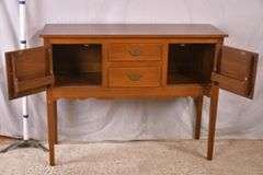 Suter's walnut huntboard with tapered legs; 200-228