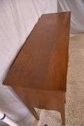 Suter's walnut huntboard with tapered legs; 200-228