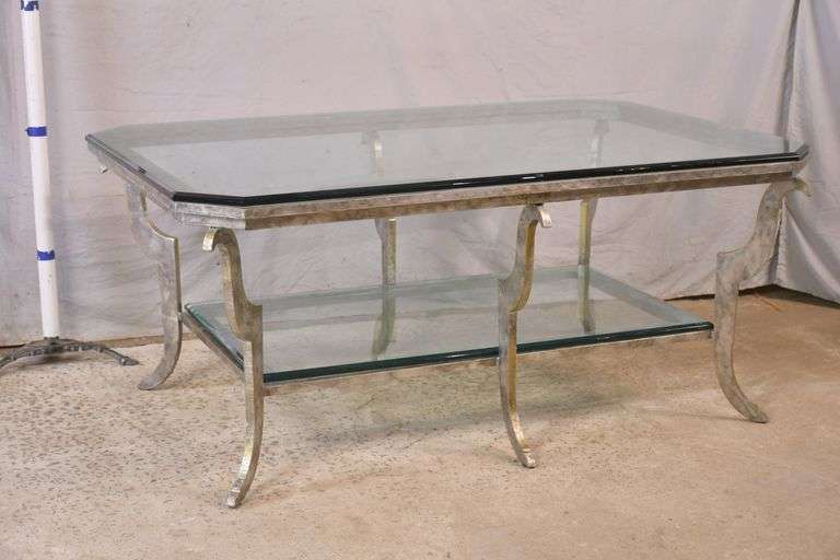 Large silver metal coffee table with beveled glass top and shelf; 68