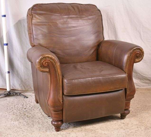 BradingtonYoung brown leather reclining armchair with brass nail head