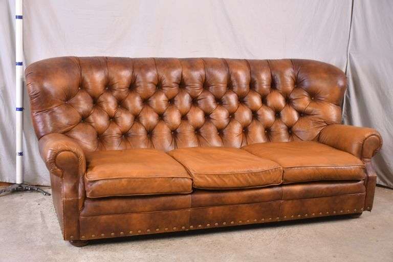 Leather Creations distressed brown leather sofa with tufted back; 336