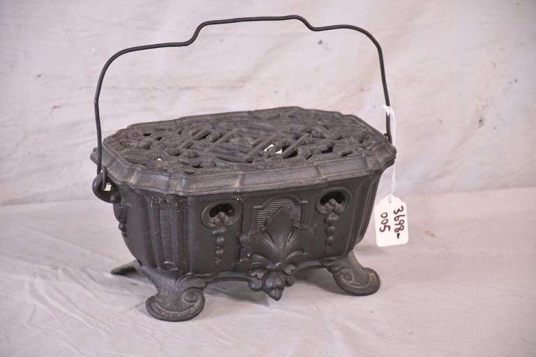 Small vintage ornate cast iron foot warmer; 3698005 R.H. Lee & Co