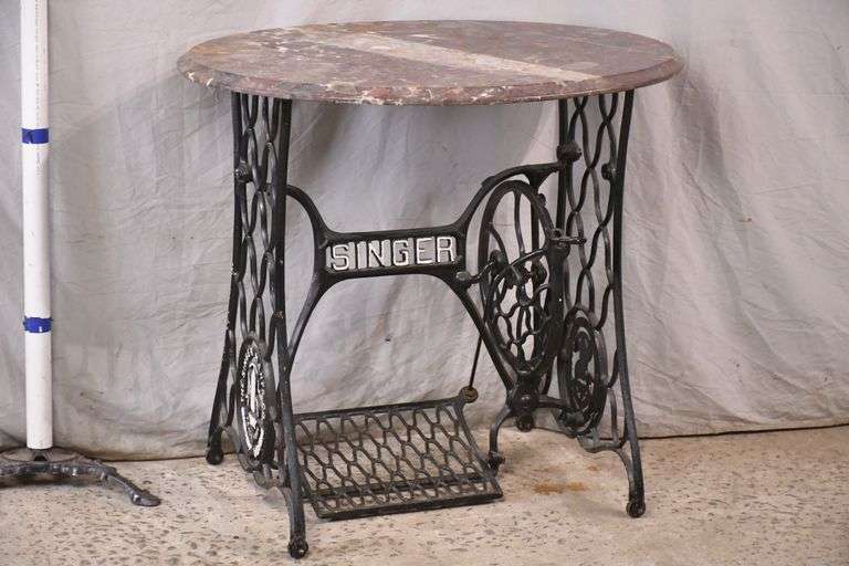 Oval marble top side table with iron Singer sewing machine base; 13024