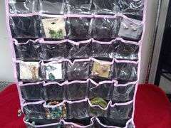 Hanging 2-sided Closet jewelry organizer with some costume jewelry