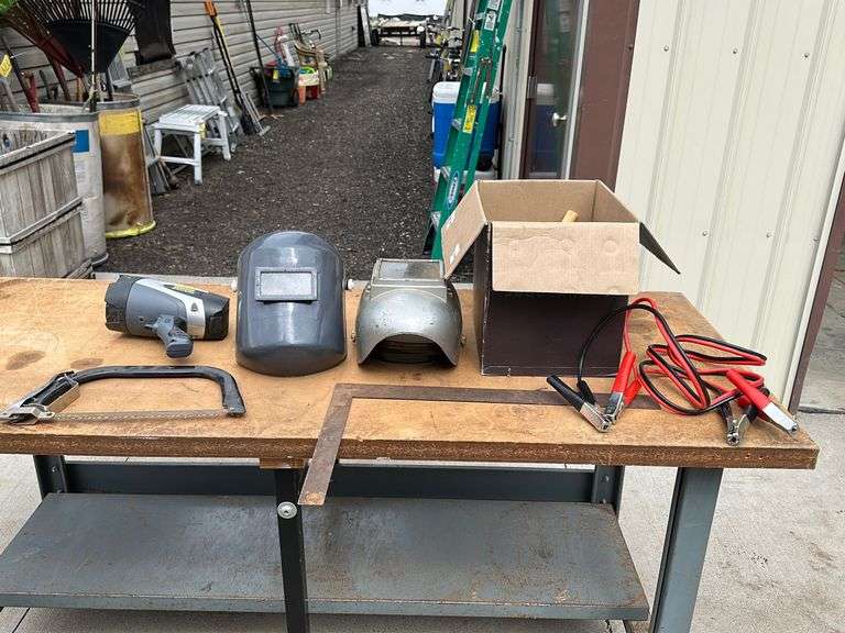 (2) Welding helmets, jumper cables, etc Lee Real Estate & Auction Service