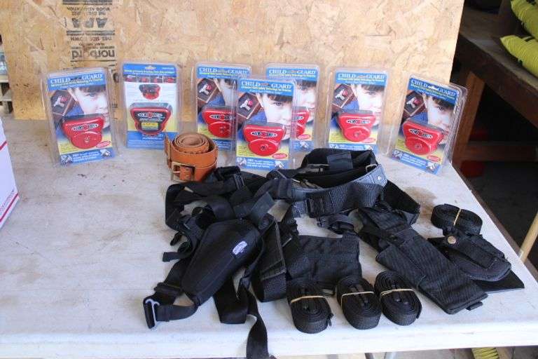 Gun holsters & 7 new child locks for guns Lee Real Estate & Auction