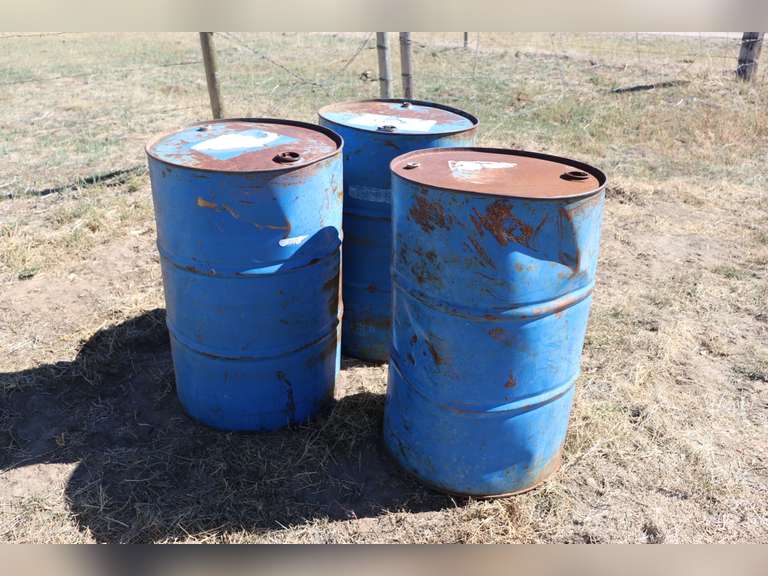 3 50gal empty barrels Adam Marshall Land & Auction, LLC