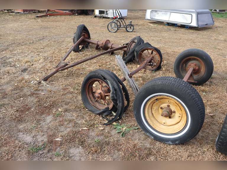 (2) wagon axles and one axle with tongue Adam Marshall Land & Auction