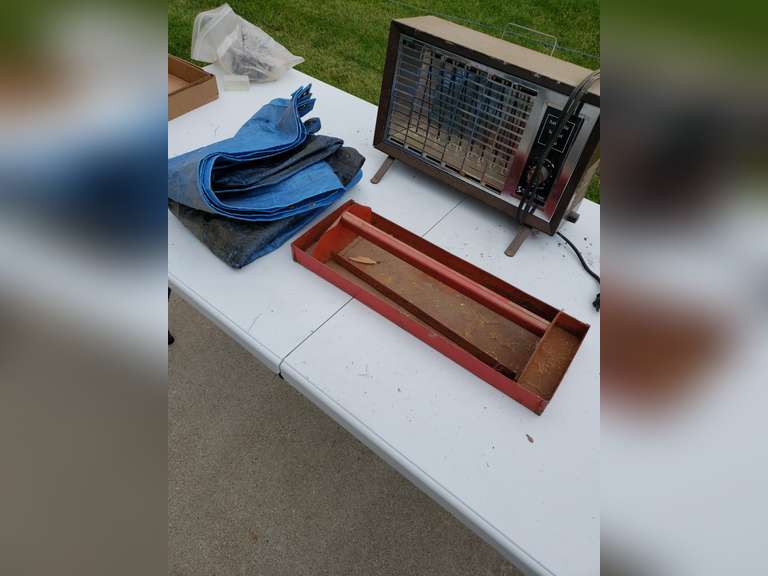 Heater, tarp and tool carrier Adam Marshall Land & Auction, LLC