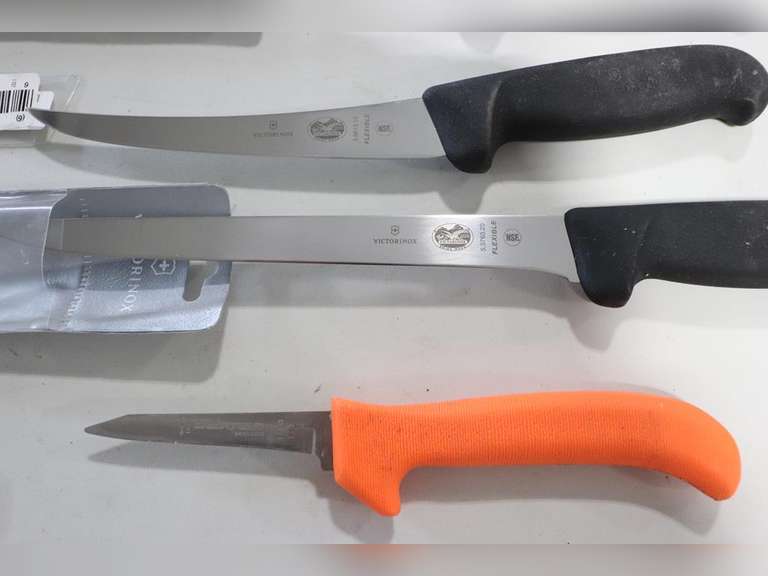 4 Knives, 3 are Victorinox, 1 is Dexter Adam Marshall Land & Auction, LLC