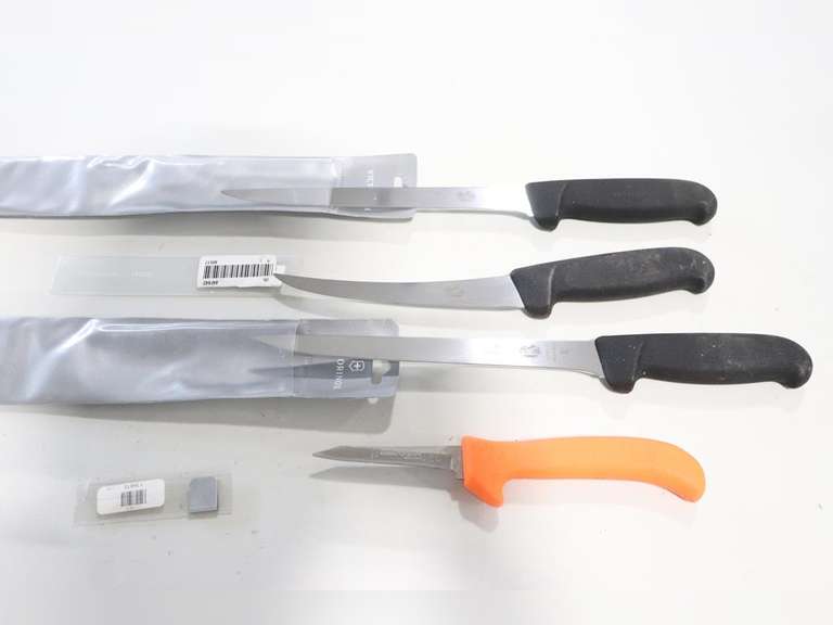 4 Knives, 3 are Victorinox, 1 is Dexter Adam Marshall Land & Auction, LLC
