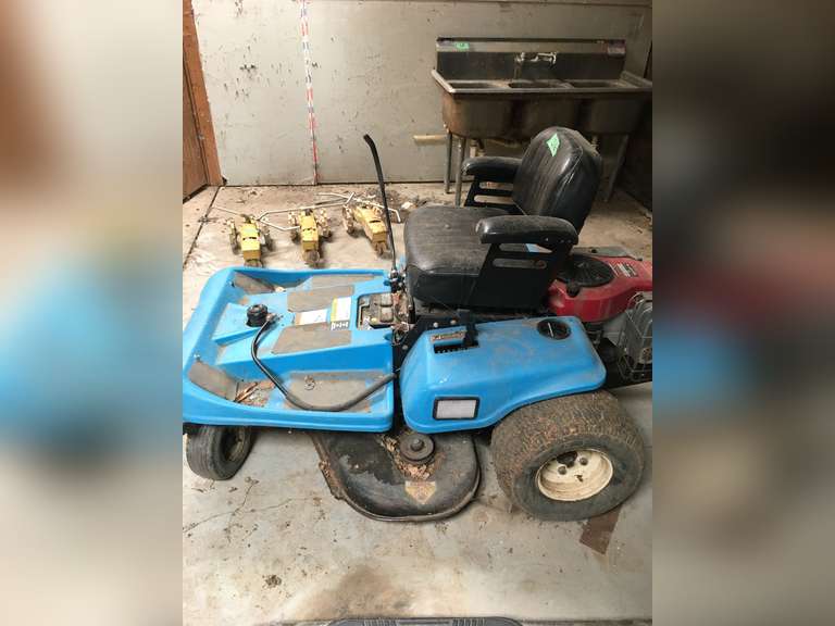 Blue zero turn mower Adam Marshall Land & Auction, LLC