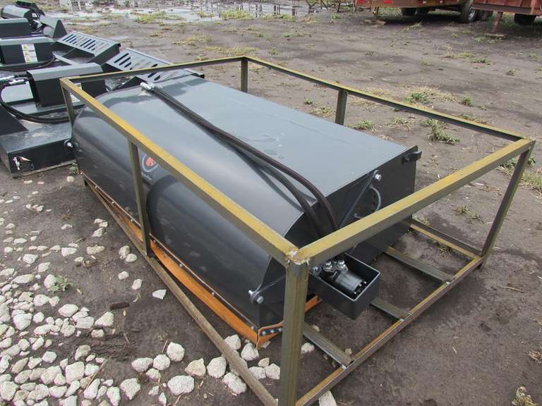 New Wolverine 6' wide hydraulic sweeper for skid steer Adam Marshall Land & Auction, LLC