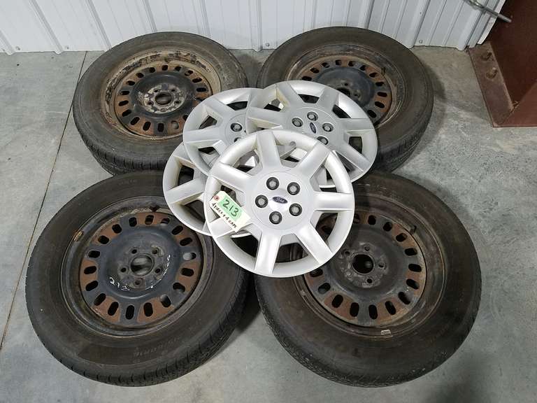 (4) 215/60R16 Tires W/ Rims (2GoodYear, 2Douglas) W/ (4) Ford Caps