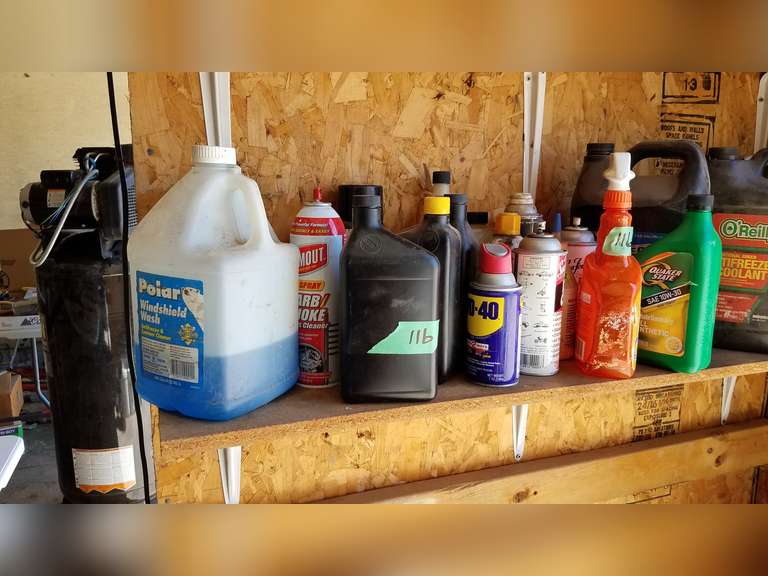 Items on shelf oil, antifreeze, cleaner Adam Marshall Land