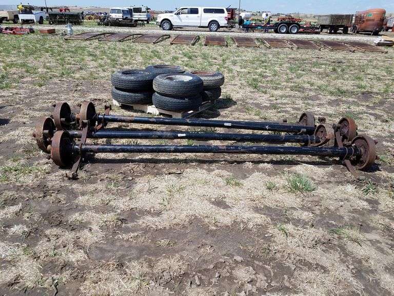 (4) Trailer House Axles & 8 Wheels/Tires Adam Marshall Land & Auction