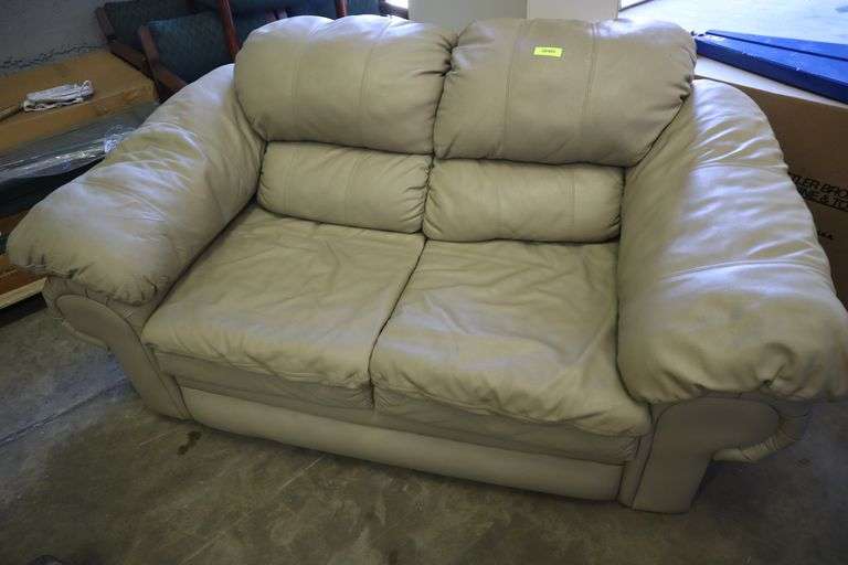 Leather Loveseat Has been used Matthews Auctioneers