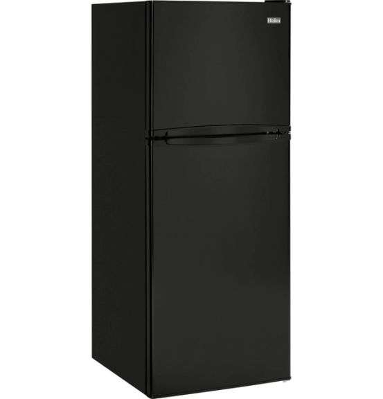 Haier 9.8 cu ft top freezer refrigerator Has some slight dents on the