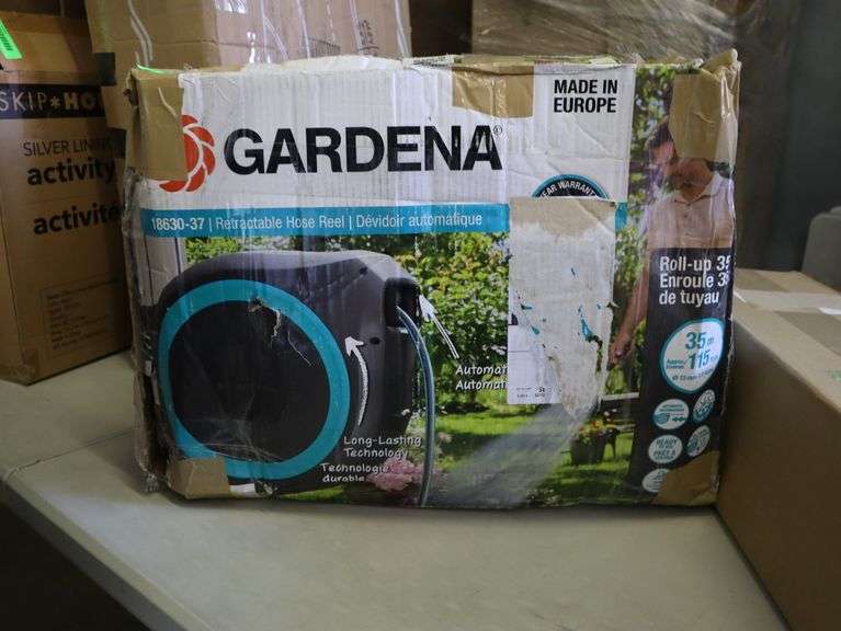 Gardena retractable hose reel Has been used Matthews Auctioneers