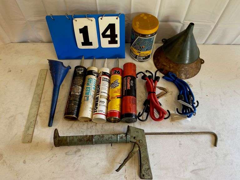 3) funnels, 4) bungee cords 35", caulking gun, 6 piece bungee cords( 2) 30inch, 2) 20inch, 2) 15inch in jar, costal grease, construction adhesive , silicone acrylic latex caulk, DAP