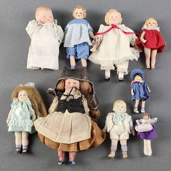 Group of 9 porcelain bisque dolls Matthew Bullock Auctioneers