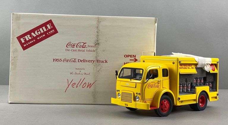 A Danbury Mint 1955 Coca Cola Delivery Truck in box. Truck measures 24x11cm. Box measures