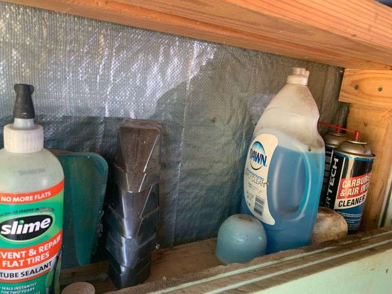 Shelf contents paint tire sealantmore McNatt Real Estate