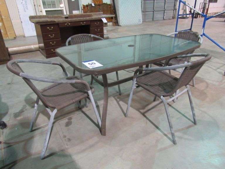 GLASS TOP PATIO TABLE W/4 CHAIRS McPherson Auction & Realty