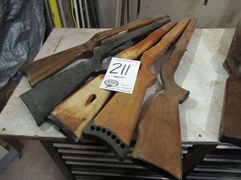 4 WOODEN RIFLE STOCKS & 1 SYNTHETIC McPherson Auction & Realty