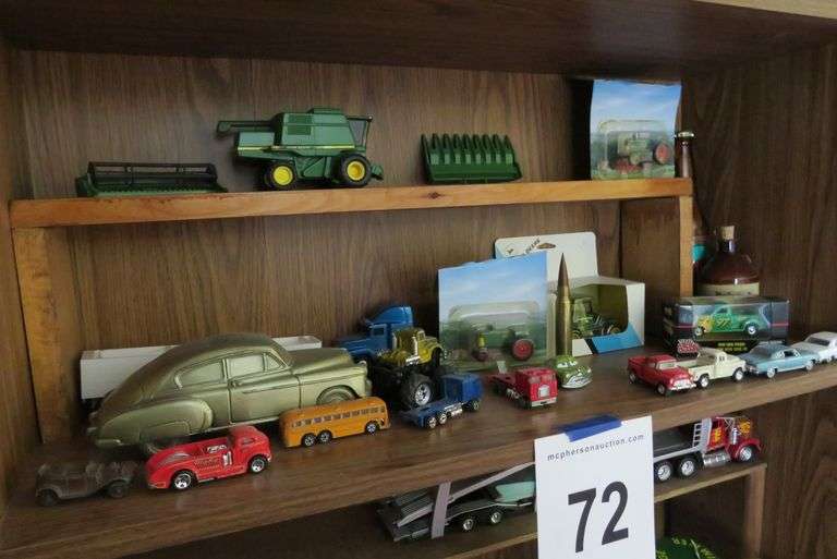 2 SHELVES OF JOHN DEERE AND OTHER TOY TRUCKS McPherson Auction & Realty