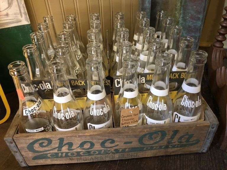 Complete set of Chocola bottles and crate Metzger Property Services LLC