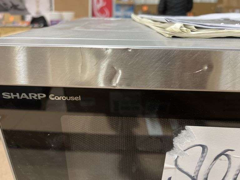 Sharp microwave ovenhas scratches and dingsmissing plate Metzger Property Services LLC