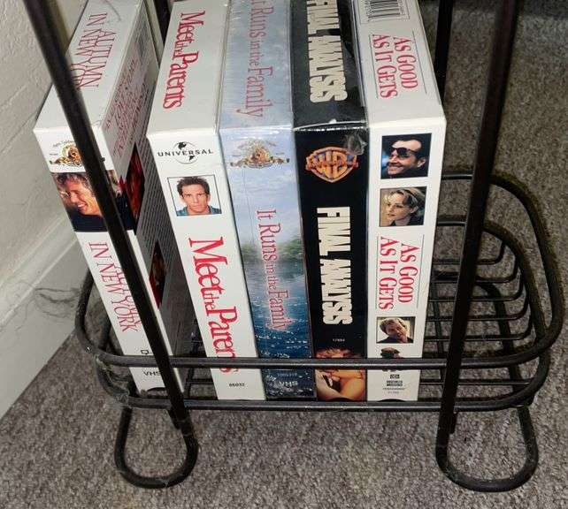 VHS and DVDs in stand Metzger Property Services LLC