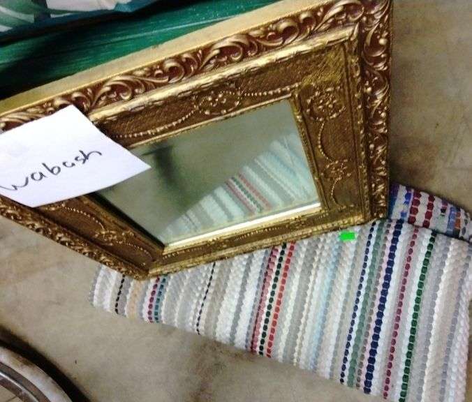 Mirror and rugs Metzger Property Services LLC