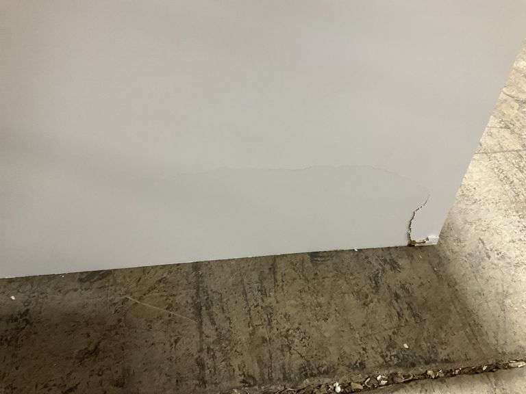 White cracked on back corner, 34 in. H x 36 in. W x 24 in. D