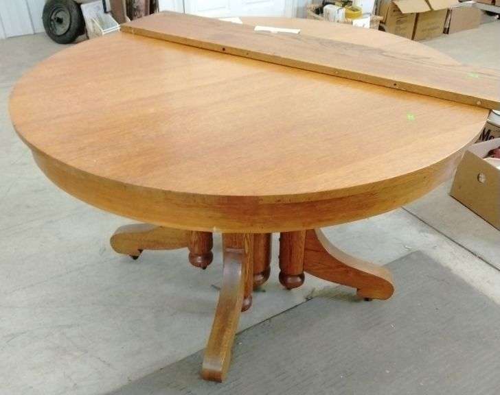 Oak pedestal dining table with casters and leaf Metzger Property