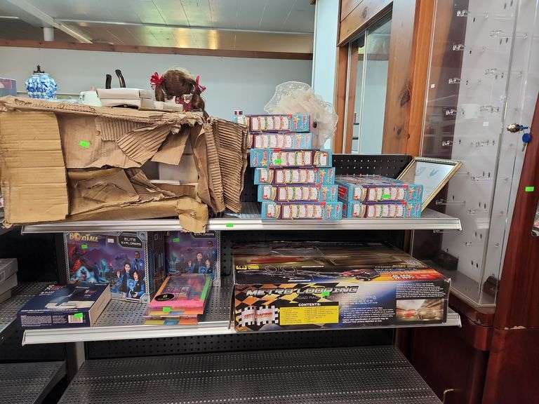Assorted board games and toys shelf not included Metzger Property