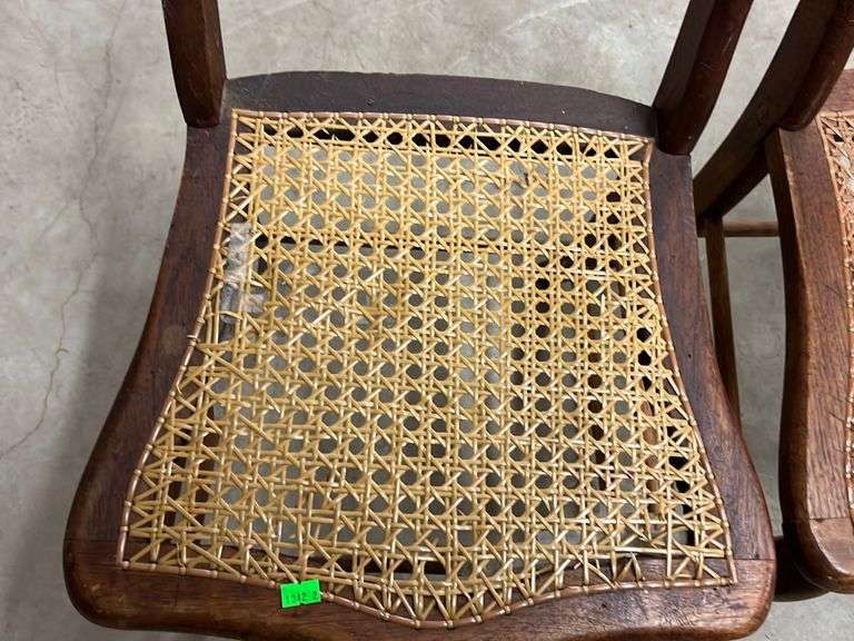 Two cane bottom chairs cane is damaged on one chair Metzger