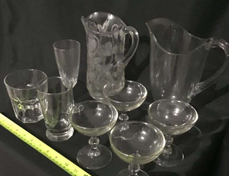 Clear, pattern glass pitchers and stemware assortment