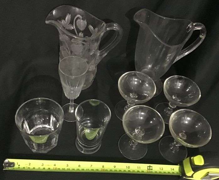 Clear, pattern glass pitchers and stemware assortment