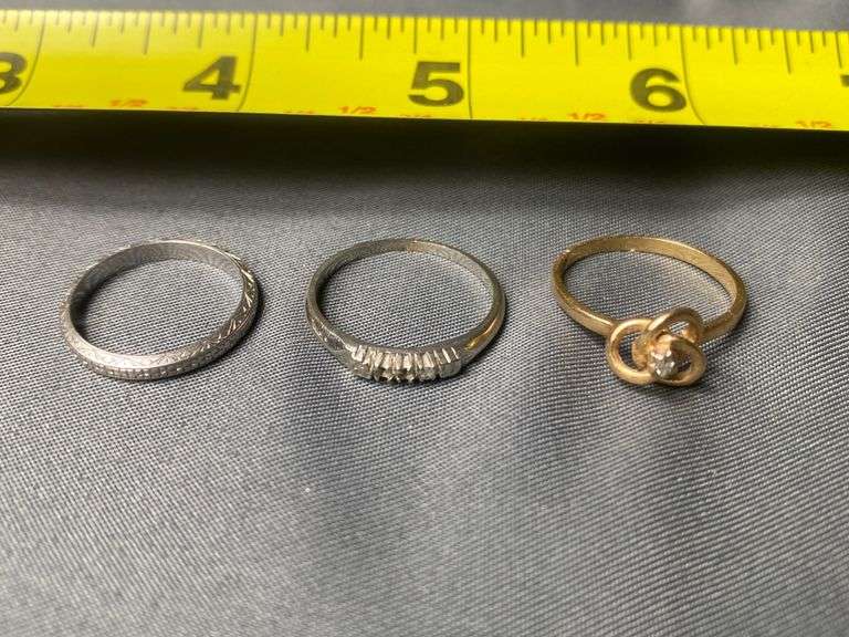 Hold and platinum rings Metzger Property Services LLC