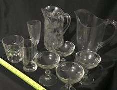Clear, pattern glass pitchers and stemware assortment