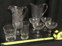 Clear, pattern glass pitchers and stemware assortment