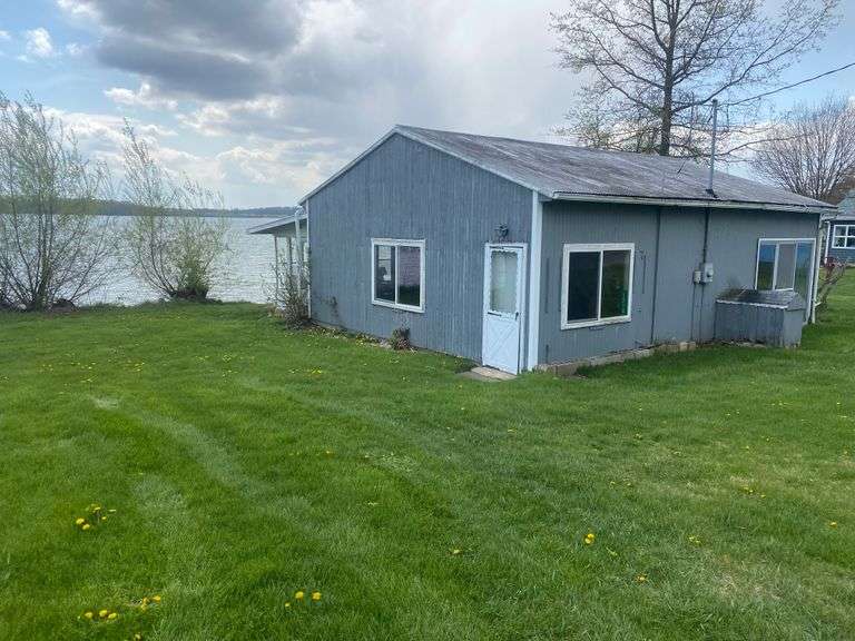 SEASONAL LAKEFRONT CABIN ON OLIVER LAKE SELLING AT ABSOLUTE AUCTION