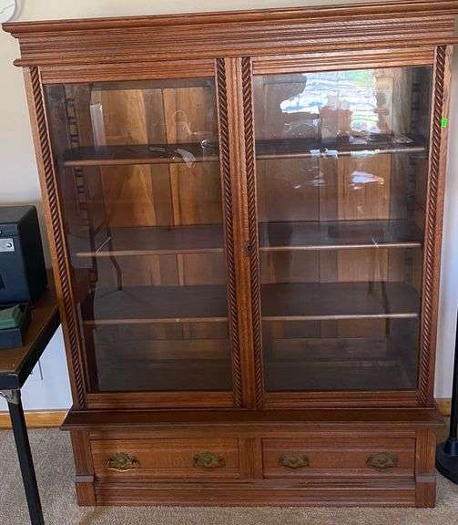 Glass front bookcase 48x14x61 Metzger Property Services LLC