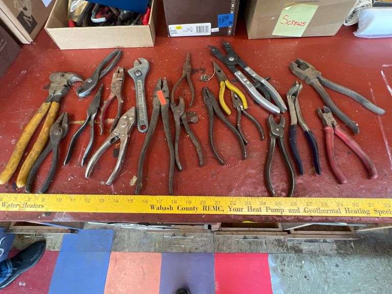 Fence pliers, adjustable wrench, assorted tools Metzger Property