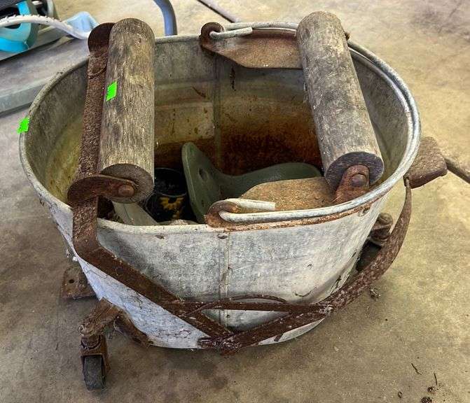 Vintage Galvanized mop bucket with wood rollers Metzger Property