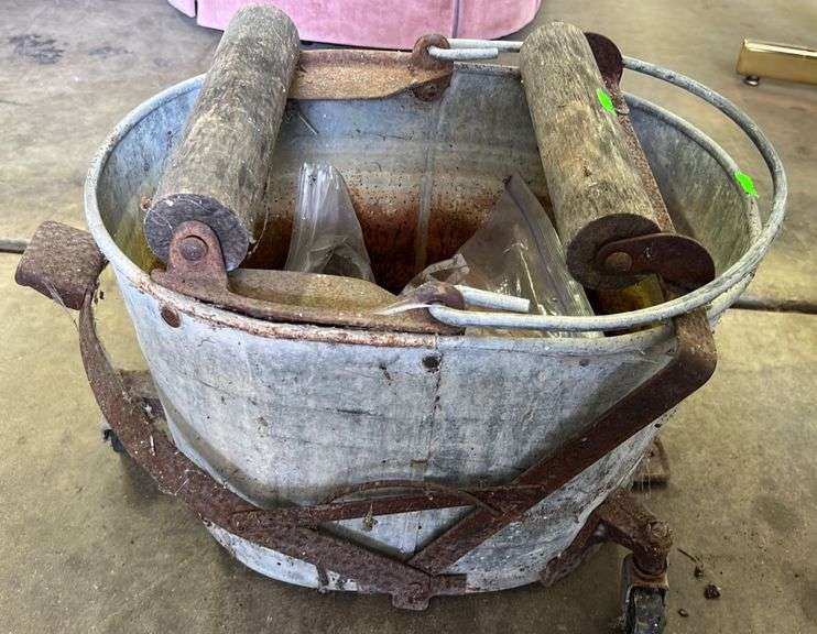 Vintage Galvanized mop bucket with wood rollers Metzger Property