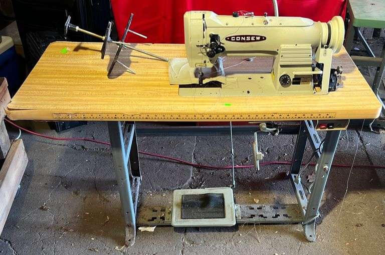 Consew model 225RB3 commercial sewing machine on sewing table with