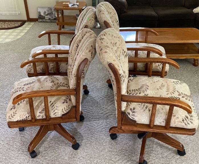 4 Upholstered wood dining chairs on casters Metzger Property